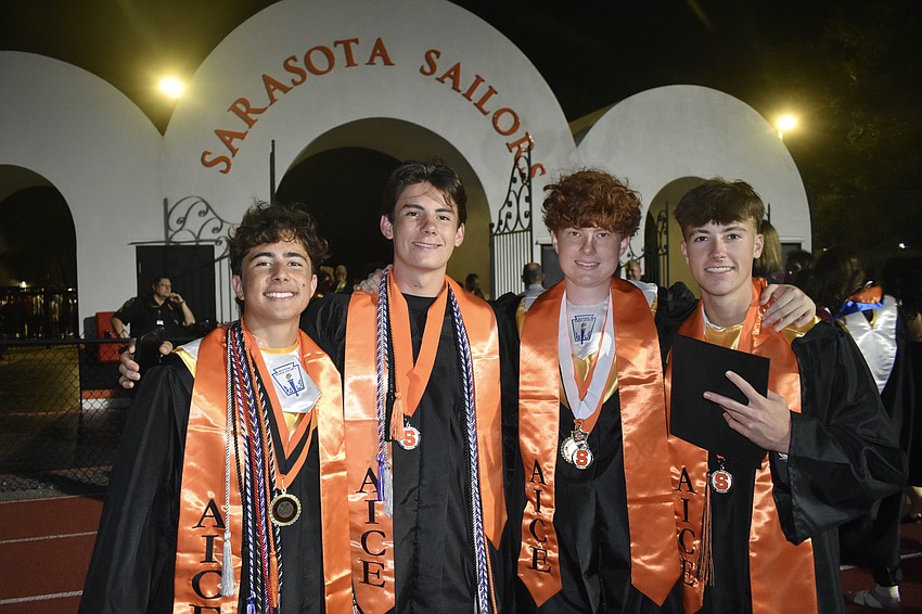 Charlie Rasool, Costa Arent, Michael Stahl and Evan Whitlock celebrate graduating.