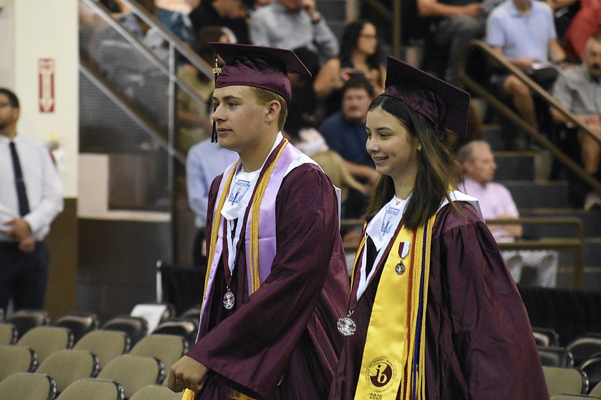 Cole Gibson and Natalie Ceaser head down the aisle.