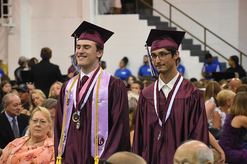 Brent Barnes and Tyler Barnes head down the aisle.