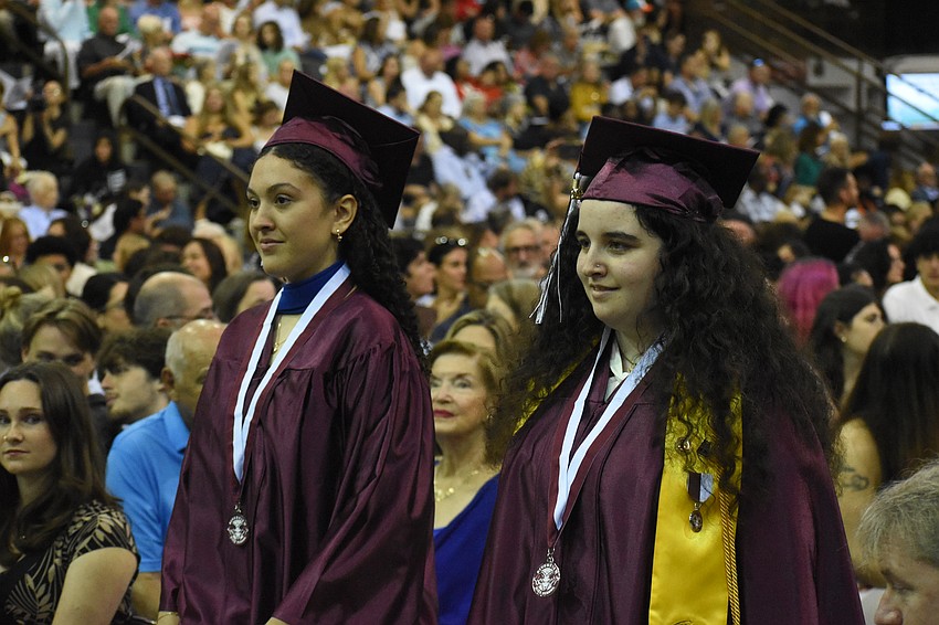 Andrea Casado Valladares and Jacqueline Buechel prepare to graduate.