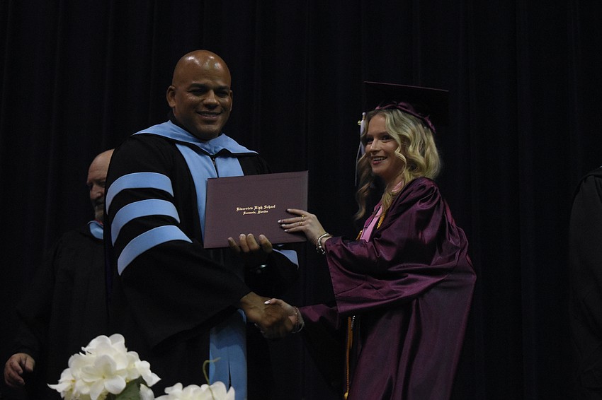 Nate Francis, executive director of secondary schools, greets Sasha Mier.