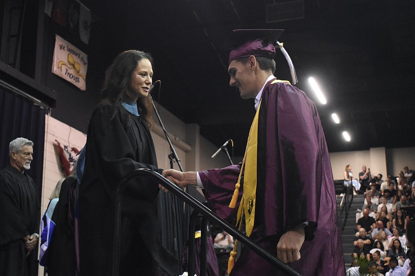 Principal Erin Haughey greets Lazar Piletich.