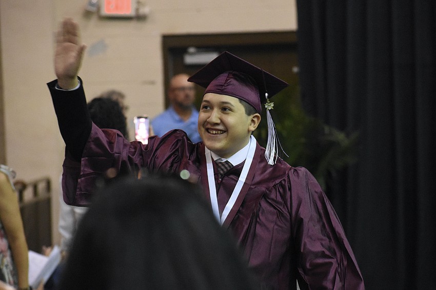 Axl Sanchez waves towards the crowd.
