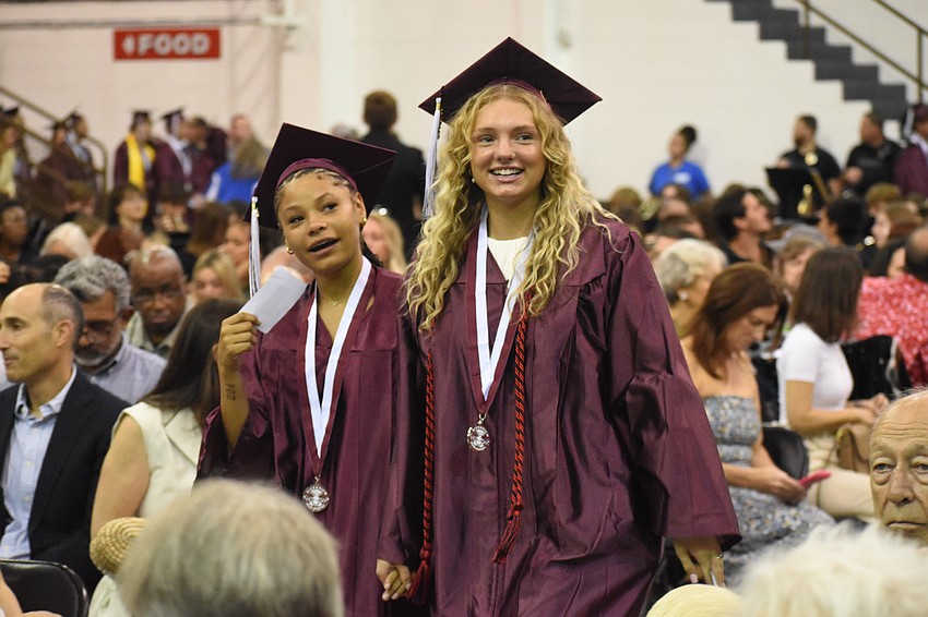 Nelise Washington and Addison Verville look towards the crowd as they make their walk.