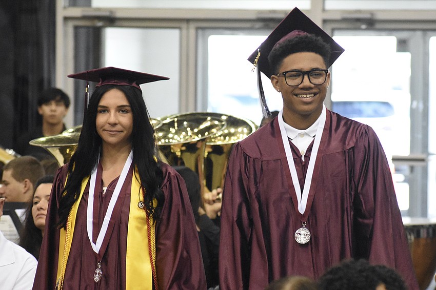 Gwendolyn Woodbury and Deon White head down the aisle.