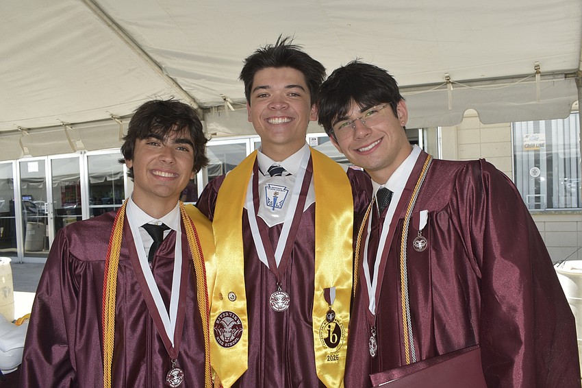 Bruno Cruz, Austin Hockett and Justin Lepow celebrate graduation.