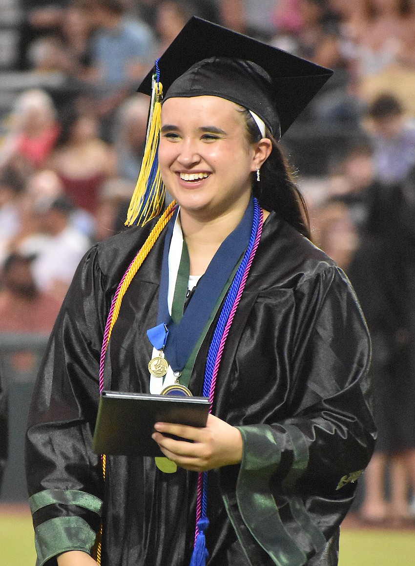 Emma Mandzik accepts her diploma with mixed emotions as her time at Lakewood Ranch High School has ended. She says she will look back on how well she was supported by her friends.
