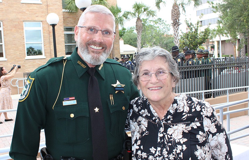 Sheriff Rick Wells visits with Karen Clark following the Manatee County Law Enforcement Memorial Service May 14.
