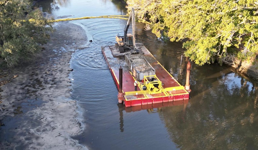 About 60,000 cubic yards were removed from a segment of Phillippi Creek. About 60,000 cubic yards were removed from a segment of Phillippi Creek.