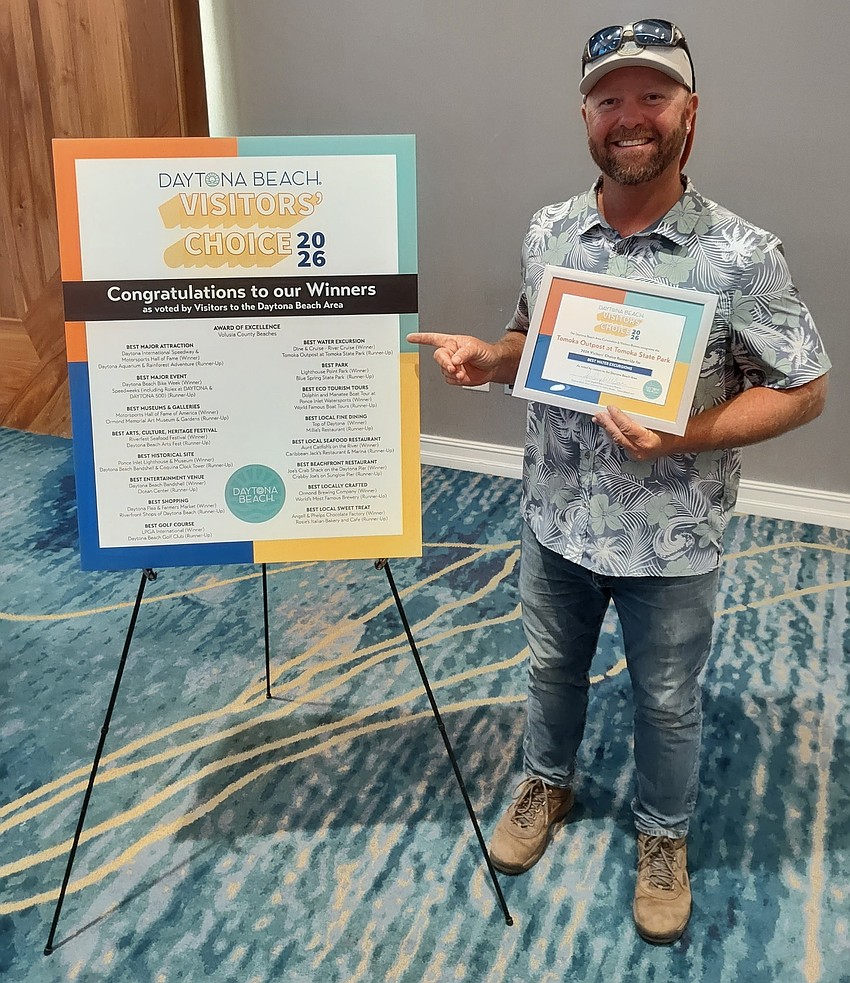 Scott Cornelius, of the Tomoka Outpost, celebrates his award from the CVB. Courtesy photo
