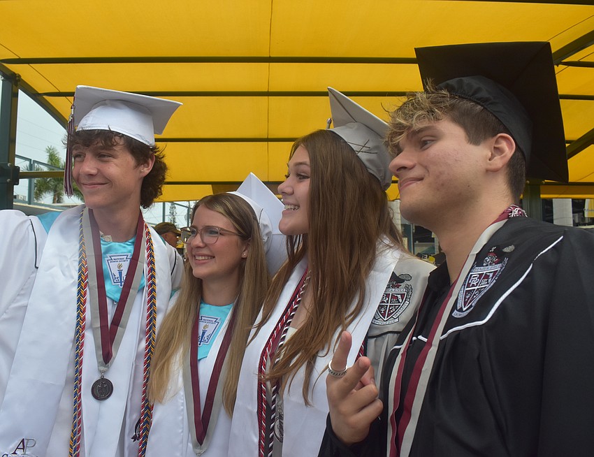Jacob Zinkhan, Sophi Jo Branscomb, Kylie Mohamed and Luis Chacon pose for a selfie prior to the Braden River High School commencement ceremony at LECOM Park.
