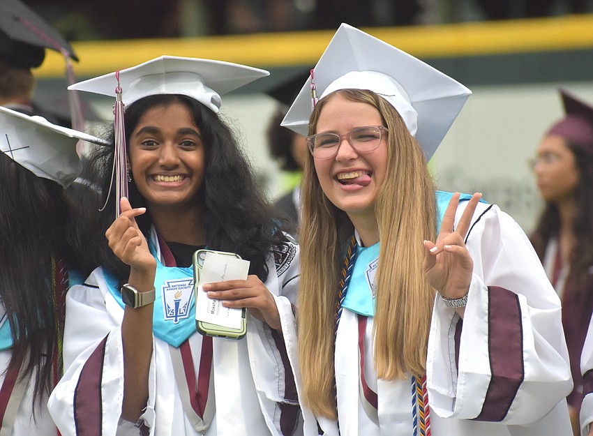 Moksha Pitchala and Sophi Jo Branscomb eagerly await the start of the Braden River High commencement ceremony May 19.