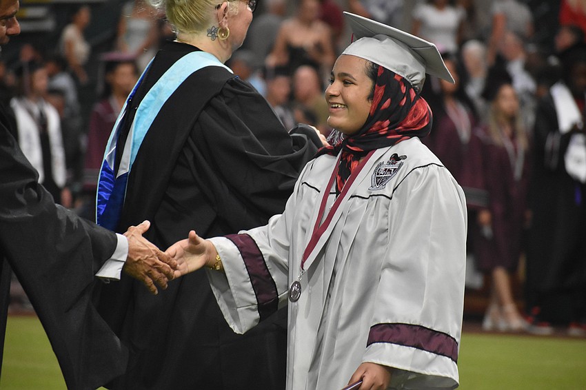 Aliyah Fatmi says she felt relieved and proud when her name was called to receive her diploma from Lakewood Ranch High School.