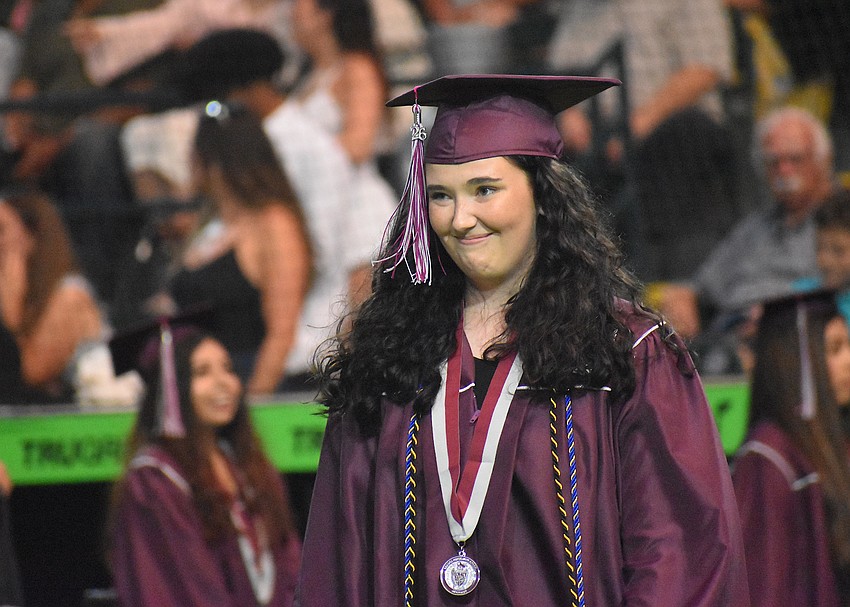Kaylynn Magee, who served as public affairs officer for the Braden River JROTC, makes her way over to receive her diploma.