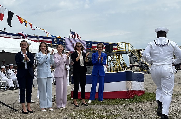 Robyn Modly, right, and her three daughters and daughter-in-law — the matrons of honor — cheered the 100 crew members as they ran by to board and officially staff the ship. From left: Natalie Modly Schmidt, Amanda Merkle Modly, Dorian Modly and Noelle Modly Ulman.