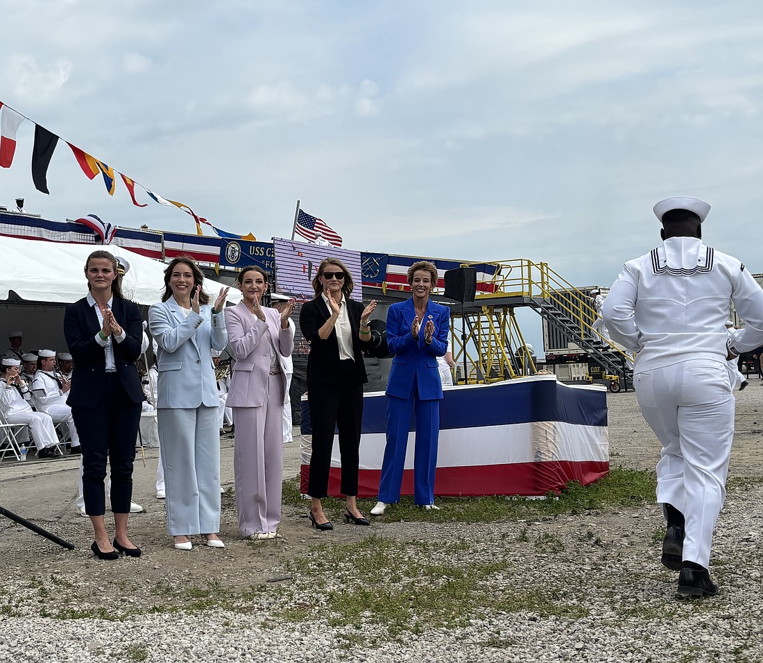 Robyn Modly, right, and her three daughters and daughter-in-law — the matrons of honor — cheered the 100 crew members as they ran by to board and officially staff the ship. From left: Natalie Modly Schmidt, Amanda Merkle Modly, Dorian Modly and Noelle Modly Ulman.