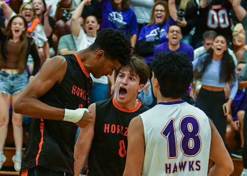Senior middle Joshua Robinson celebrated after he blocked the ball in the state championship game, and setter Rafael Melo cheered for his teammate. The team played its best game when the players were out there having fun for one another.