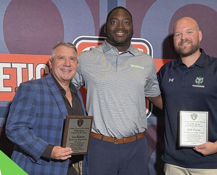 Lou Romao, left, and Kyle Casias, right, celebrated earning the coach of the year.