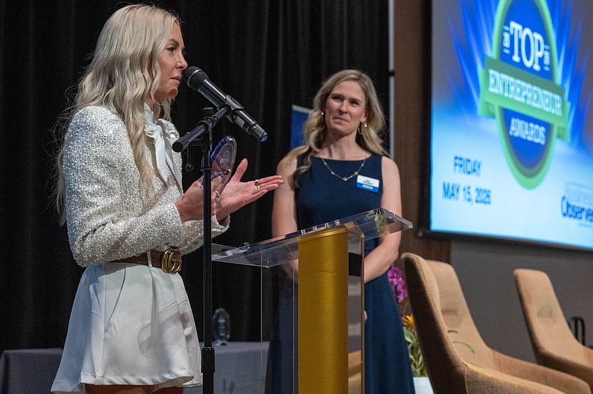 Roberta Beranek, left, was one of the six winners. She thanked her team after receiving an award from Observer Media Group Executive Editor and COO Kat Wingert.