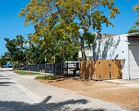 Grant's Gardens has a two-bay garage at 525 Gulf Bay Road, and is proposing to build an office building on the lot across the street at 524 Gulf Bay Road.