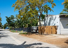 Grant's Gardens has a two-bay garage at 525 Gulf Bay Road, and is proposing to build an office building on the lot across the street at 524 Gulf Bay Road.