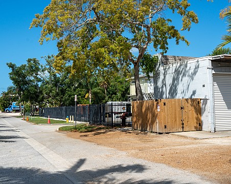 Grant's Gardens has a two-bay garage at 525 Gulf Bay Road, and is proposing to build an office building on the lot across the street at 524 Gulf Bay Road.