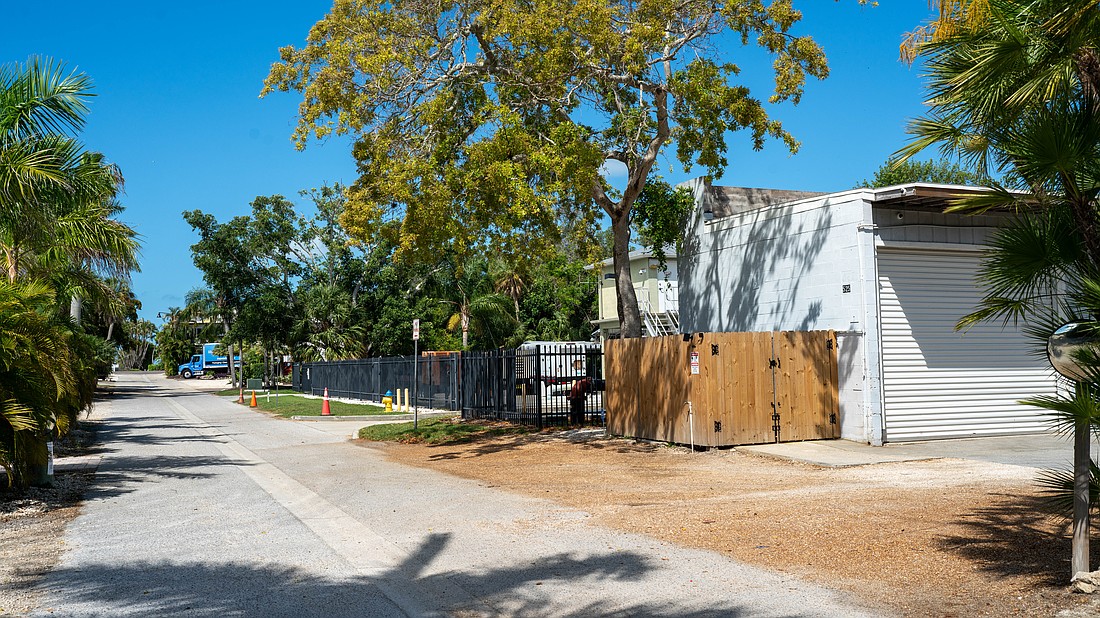 Grant's Gardens has a two-bay garage at 525 Gulf Bay Road, and is proposing to build an office building on the lot across the street at 524 Gulf Bay Road.