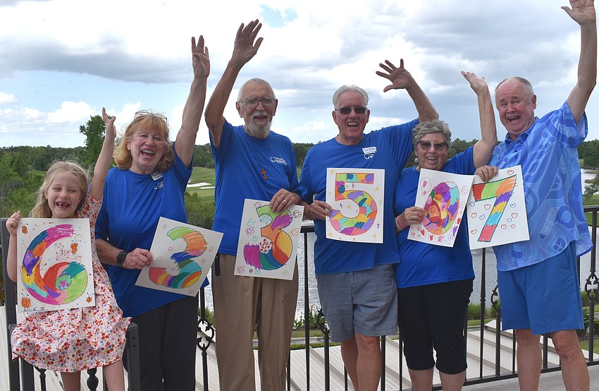 Ellie Tullidge, Stillpoint Mission volunteers Linda Berman, Gene Tischer, Larry Nekuza, Kate Nekuza and Bob Smith (front) gathered at Lakewood Ranch Country Club to celebrate the milestone of raising $633,507 over the last 15 years.