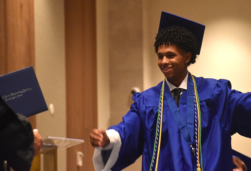 Jayden Husted, a member of the Student Government Association at Lakewood Ranch Preparatory Academy, makes a stride toward his diploma at The Ora May 20.