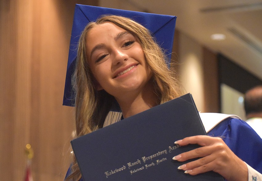 Arianna Leo, a member of National Honor Society and the Student Government Association, shows off her Lakewood Ranch Preparatory Academy diploma moments after receiving it.