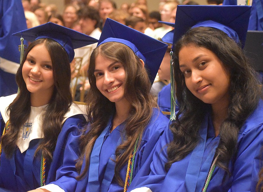 Lakewood Ranch Preparatory Academy graduates Julianna Cruz, Grace Cury and Anoop Dhaliwal await instruction to turn their tassels to signify the end of their high school careers.