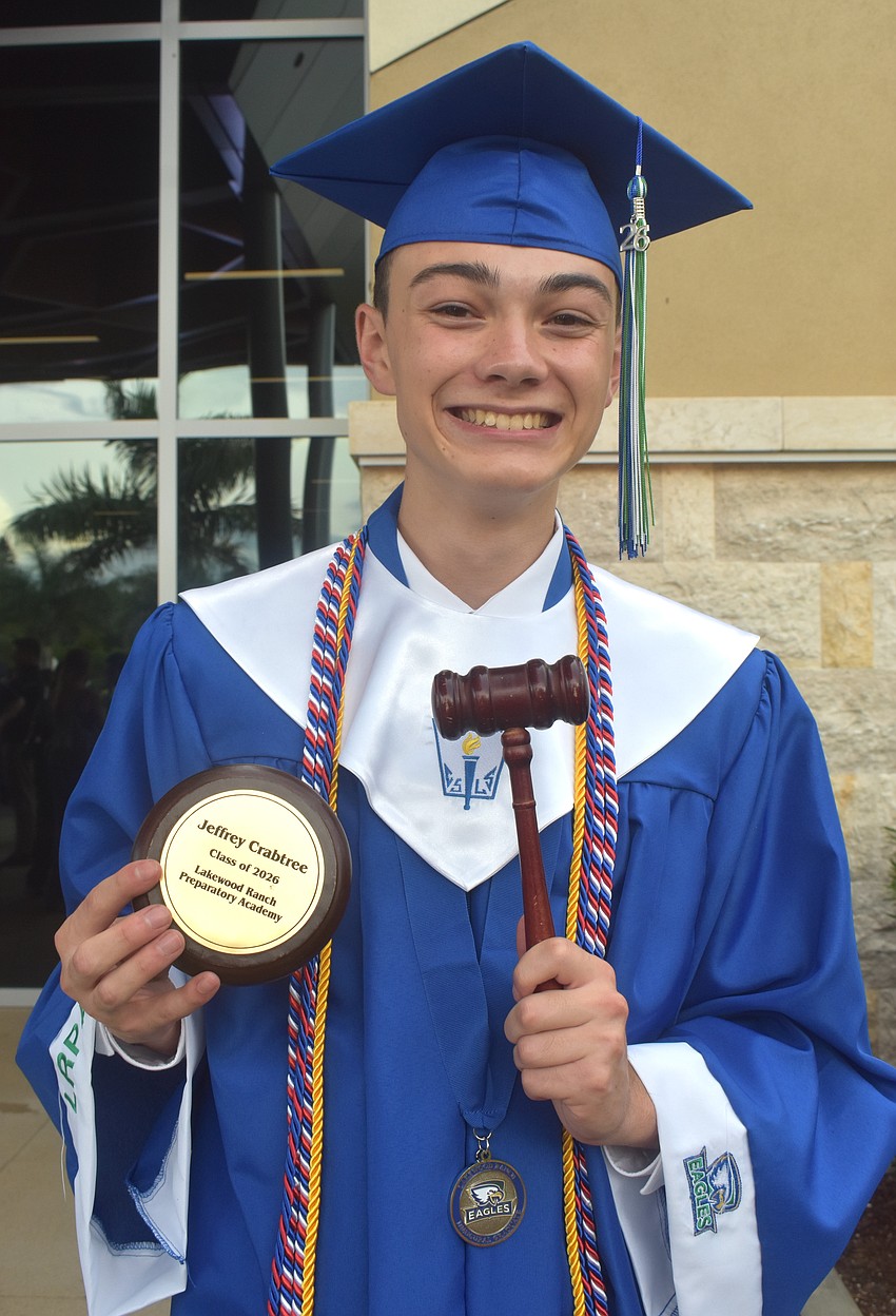 Jeffrey Crabtree, the inaugural Student Government Association supreme court chief justice, received an engraved sound block after giving a speech at the Lakewood Ranch Preparatory Academy commencement ceremony.