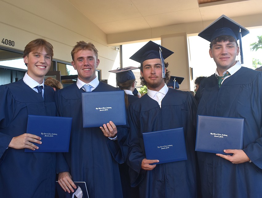 Alex Dart, Alex Fraietta, Trenton Hitchcock and James Abernathy celebrate receiving their diplomas from The Out-of-Door Academy May 22 at Grace Community Church.