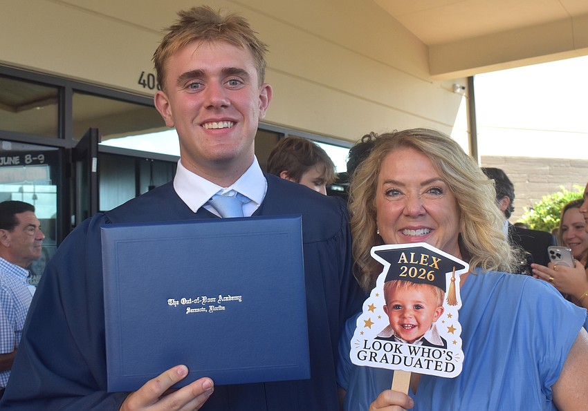 To celebrate the graduation of her son, Alex Fraietta, Diane Fraietta brought a sign of Alex as a baby.