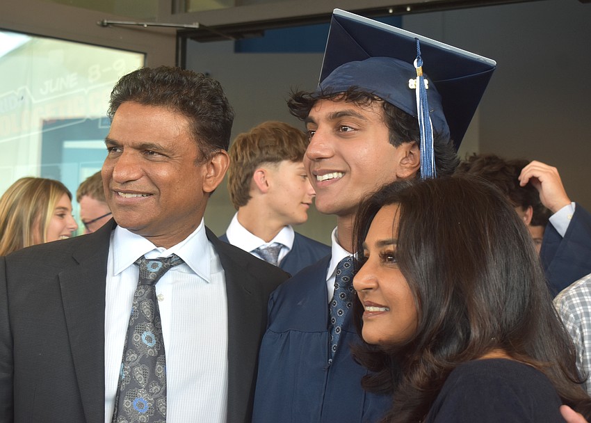 Roghu Pulluru, graduate Manav Pulluru and Chinni Pulluru celebrate at The Out-of-Door Academy graduation May 22.