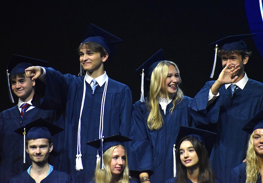Avery Fulk, Kegan Gargano, Camryn Gouldin and Kevin Gyurka find their loved ones in the audience after direction from Head of School Debra Otey to do so.