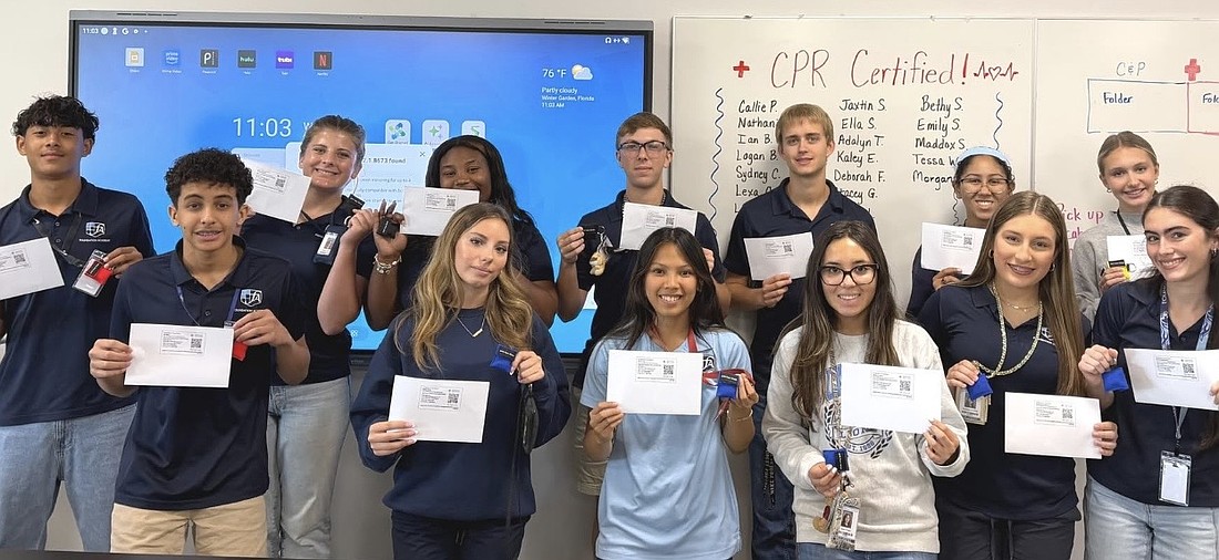 Foundation Academy's 27 students proudly held their certificates.