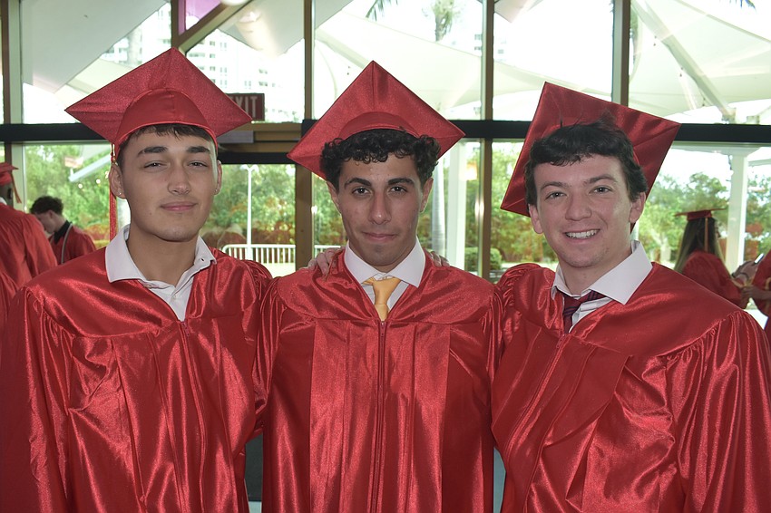 Valentino Gloria, Sam Shamsey and Ryan DiLascia prepare for graduation.