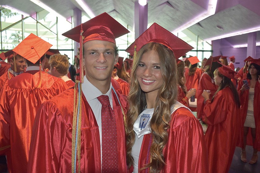 Micah Page and his girlfriend Ava Lamorey await graduation.