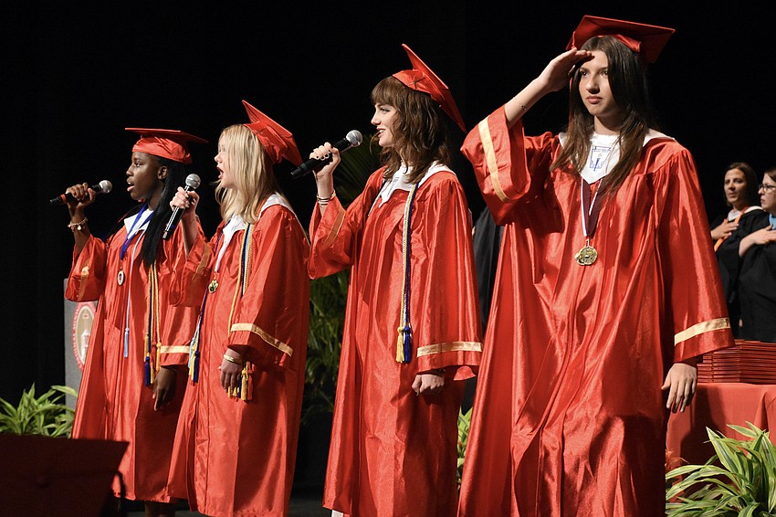 Djoudly Auguste, Kaya Hogue, Emma Stuart and Markella Polo (using American Sign Language) present the national anthem.