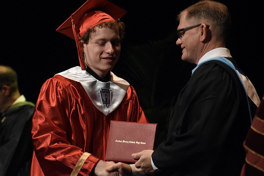 Quinn Hillerich greets Principal Ben Hopper.