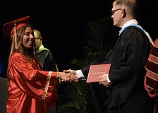 Emerson Lepper greets Principal Ben Hopper.
