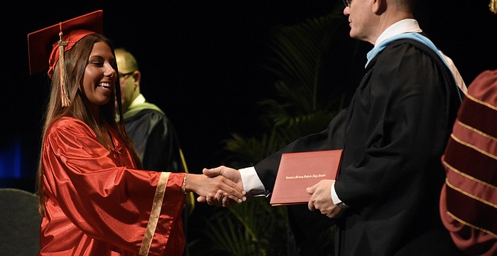 Emerson Lepper greets Principal Ben Hopper.