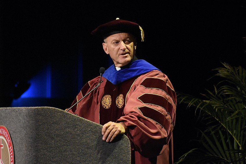 Rev. John Belmonte, superintendent of Catholic education for the Diocese of Venice, Florida, addresses the graduates.