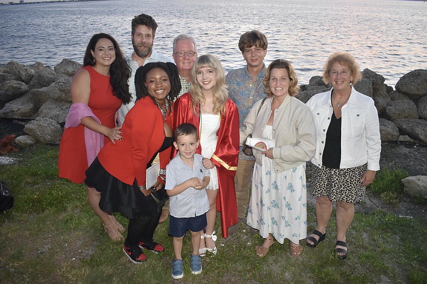 Graduate Baylee Shattenberg (center) celebrates with her family including Aline and Toby Shattenberg, Ahmaya Strange, Gary Bagwell, Stefan Shattenberg, 4, Mason Shattenberg, Brandee Shattenberg, and Betsy Bagwell.
