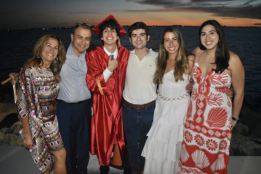 Graduate Lucas Marmelo (third from left) stands with his family including parents Maite and Roy Marmelo and siblings Andres, Julia and Claudia Marmelo.