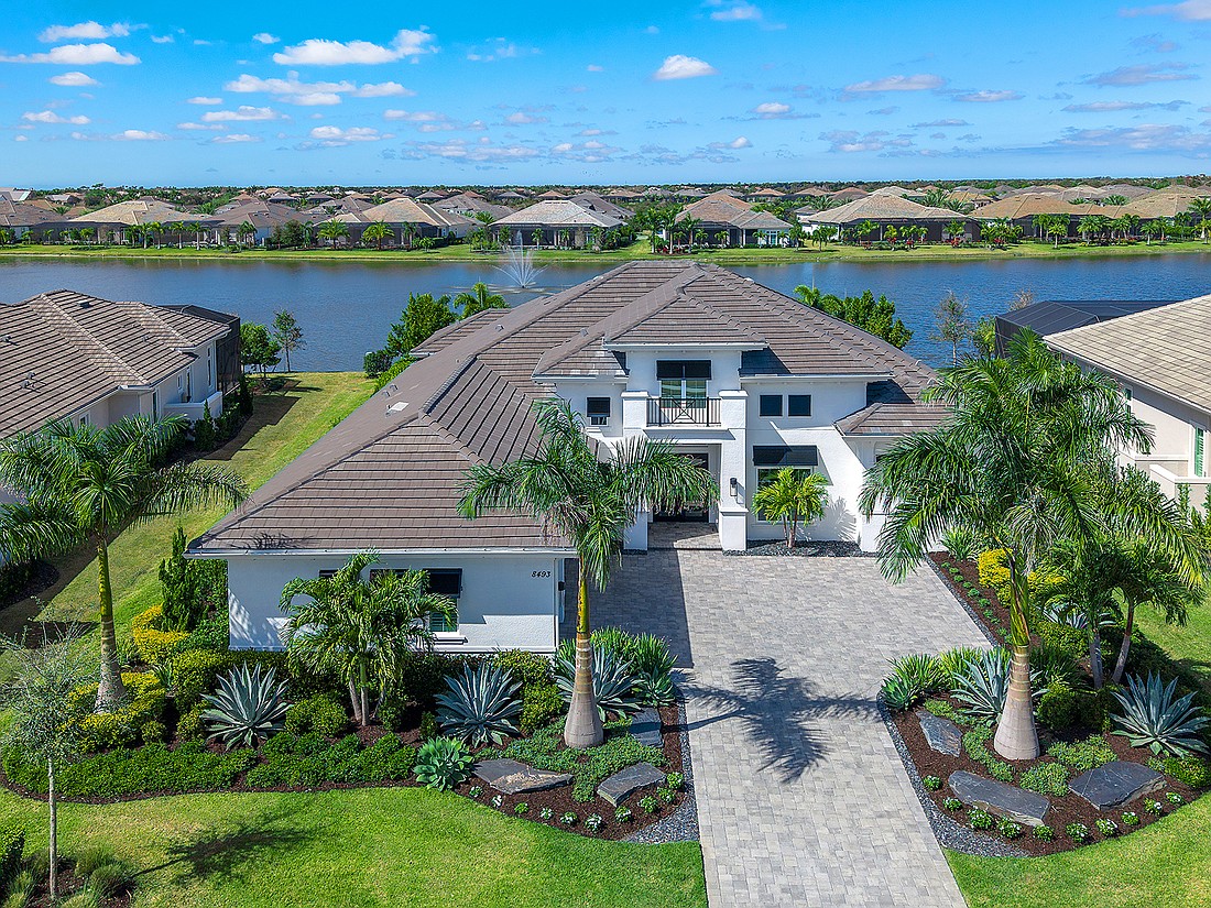 This Lake Club home at 8493 Pavia Way sold for $3.2 million. Built in 2022, it has four bedrooms, four-and-a-half baths, a pool and 3,499 square feet of living area.
