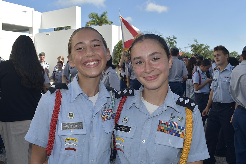 Color Guard Commander Lillian Matthews and Cadet Colonel Heloisa Monteiro, rising eighth graders at Sarasota Military Academy, prepare for the parade.