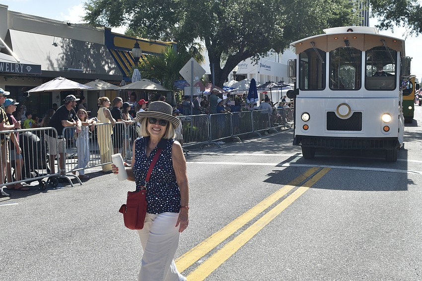 Commissioner Liz Alpert walks the parade route.