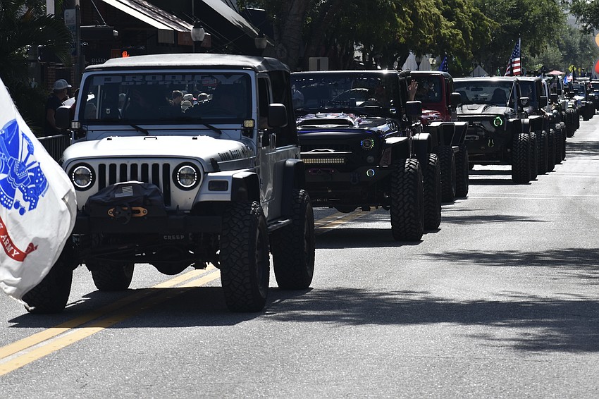 Jeeps make their way along the parade route.